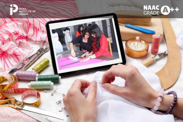 Student designing clothes at Parul Institute of Design fashion lab