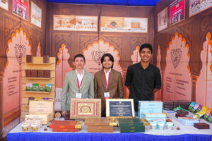 Student founders working on startup in hostel room